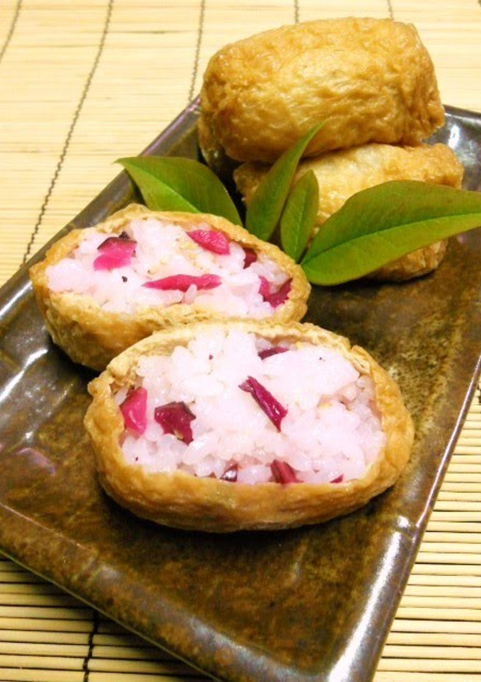 A picture of Inari Sushi with Pickles.