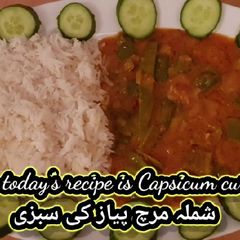 A picture of 3 colour capsicum onion curry with rice.