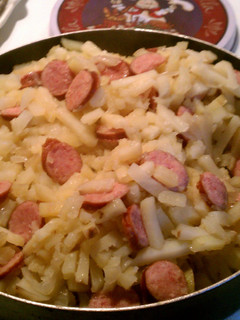 A picture of Smothered Potatoes in onions with Polish Kielbasa.