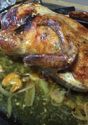 Una foto de Pato relleno asado con mandarinas