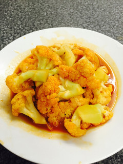 A picture of stir-fry cauliflower with ketchup and soy sause - Chinese dish.