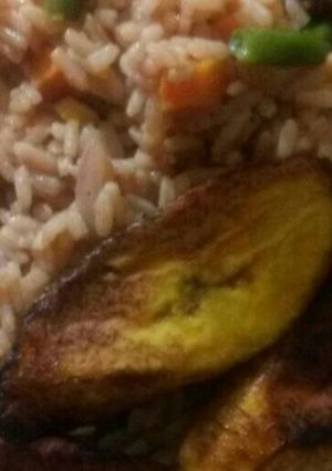 A picture of Coconut rice and liver with plantain.