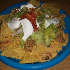 A picture of Yummy Homemade Queso Dip Nachos.
