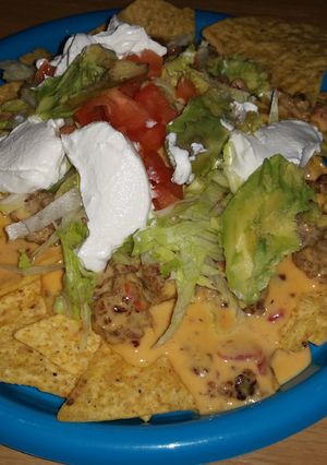 A picture of Yummy Homemade Queso Dip Nachos.