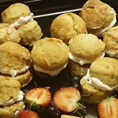 A picture of Mini scones with Jam and clotted cream.