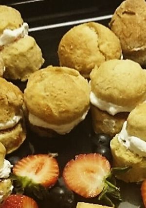 A picture of Mini scones with Jam and clotted cream.