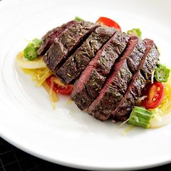 A picture of Roasted Hanger Steak with Spaghetti Squash and Okra Sauté.