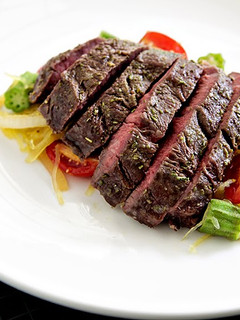 A picture of Roasted Hanger Steak with Spaghetti Squash and Okra Sauté.