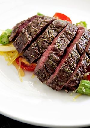 A picture of Roasted Hanger Steak with Spaghetti Squash and Okra Sauté.