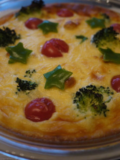 A picture of Broccoli and Tomato Christmas Flan.