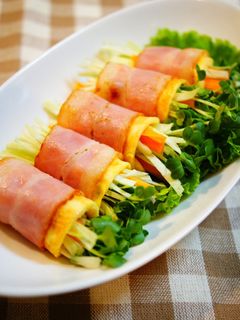 A picture of Raw Vegetables Wrapped with Bacon and Eggs.