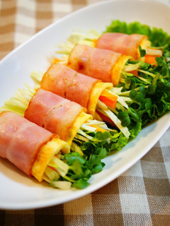 A picture of Raw Vegetables Wrapped with Bacon and Eggs.