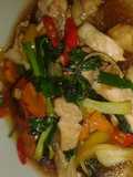 Mhu pad prik waan or pork stir fry in sweet peppers and thai chillies