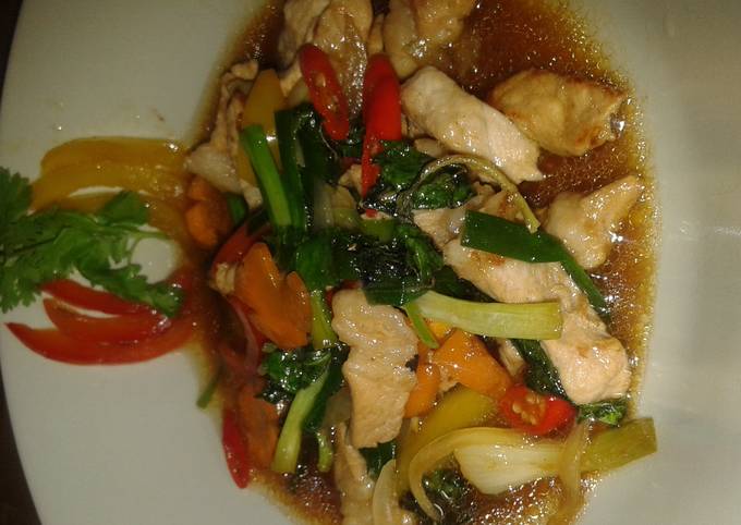 Mhu pad prik waan or pork stir fry in sweet peppers and thai chillies