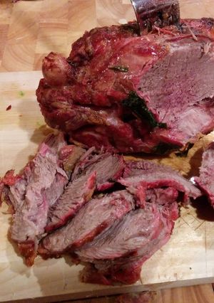 A picture of Lamb leg on foil.