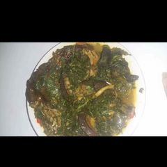A picture of Vegetable soup with snail.