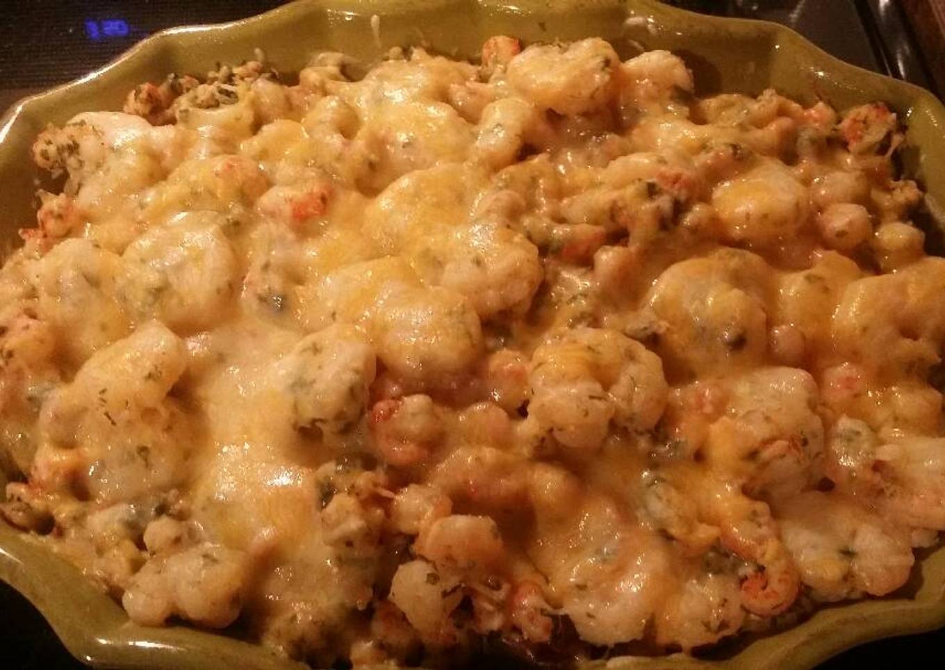 Fried potatoes in a pot with seafood