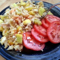 A picture of skye's yellow squash & fried brown rice.