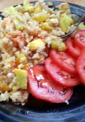 A picture of skye's yellow squash & fried brown rice.