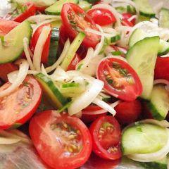 A picture of Simple Tomato Cucumber Salad with Lemon Dressing.