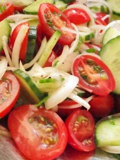 A picture of Simple Tomato Cucumber Salad with Lemon Dressing.