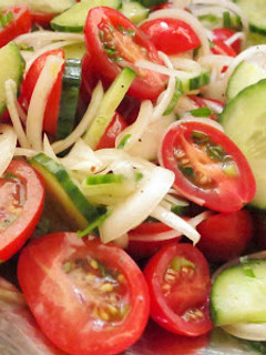 A picture of Simple Tomato Cucumber Salad with Lemon Dressing.