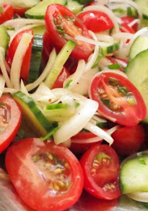 A picture of Simple Tomato Cucumber Salad with Lemon Dressing.