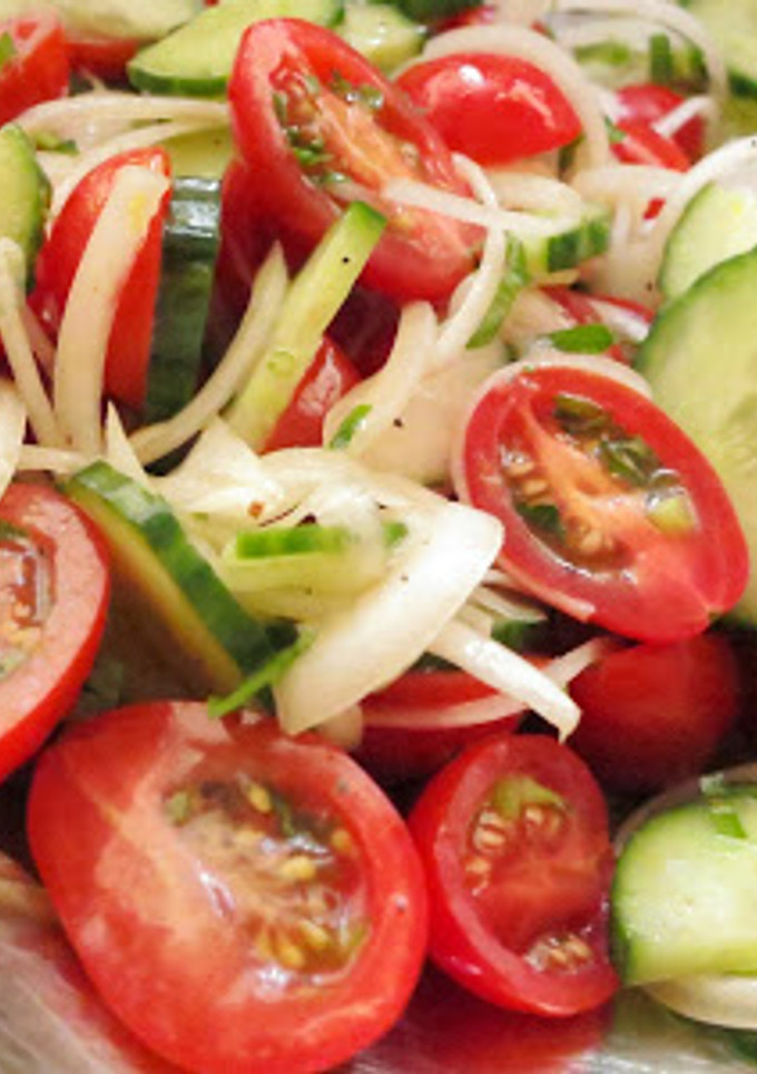 A picture of Simple Tomato Cucumber Salad with Lemon Dressing.