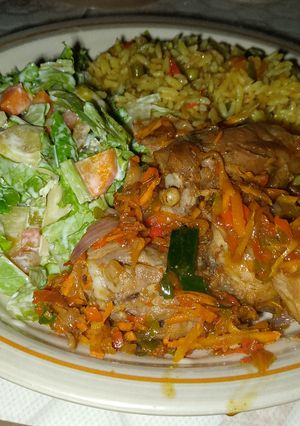 A picture of Fried rice, pepper chicken and potato salad.