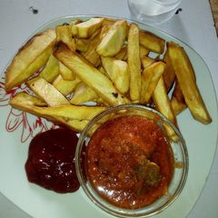 A picture of Fried Sweet potatoes, Beef stew and Ketchup.