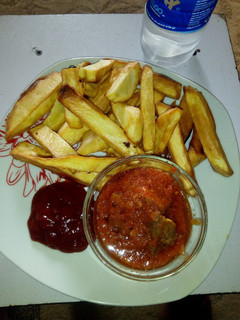 A picture of Fried Sweet potatoes, Beef stew and Ketchup.