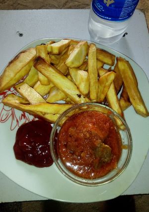 A picture of Fried Sweet potatoes, Beef stew and Ketchup.