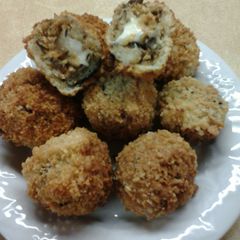 A picture of Crispy Mozerella Stuffed Chipotle Eggplant Fritters.