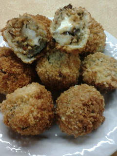 A picture of Crispy Mozerella Stuffed Chipotle Eggplant Fritters.