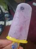 Blueberry yogurt popsicles with fresh strawberries