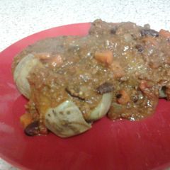 A picture of Beef Chili Con Carne over Baked Potato.