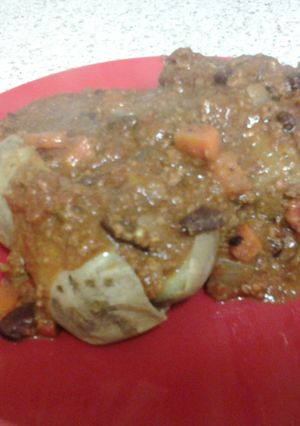 A picture of Beef Chili Con Carne over Baked Potato.