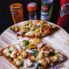 A picture of Peri Peri Thin Crust Cottage Cheese Pizza.