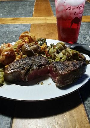 A picture of Brad's Blackened ahi with prawn buttered pasta and sautéed Brussels.