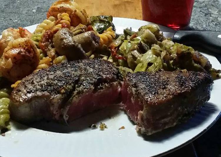 Brad's Blackened ahi with prawn buttered pasta and sautéed Brussels