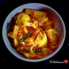 A picture of Dim alur charchori (different types of egg potato curry).