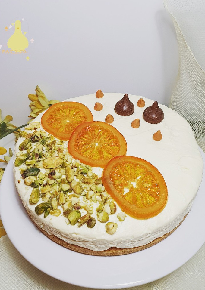 Una foto de Cheesecake de naranja, pistachos y queso philadelphia