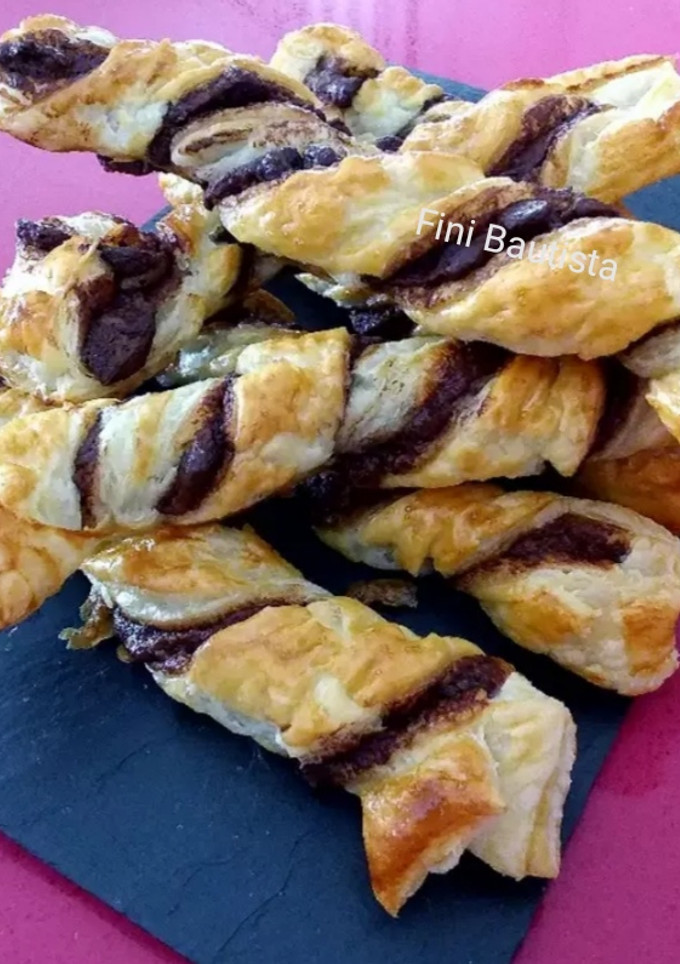 Una foto de Hojaldre sacristanes con Nutella
