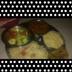 A picture of Rajmachana with Jeera rice and raita.
