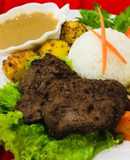 Whosaynas Gravy to serve with rice fried steak and veggies