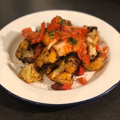 A picture of Harissa cod with spiced cauliflower and salsa.