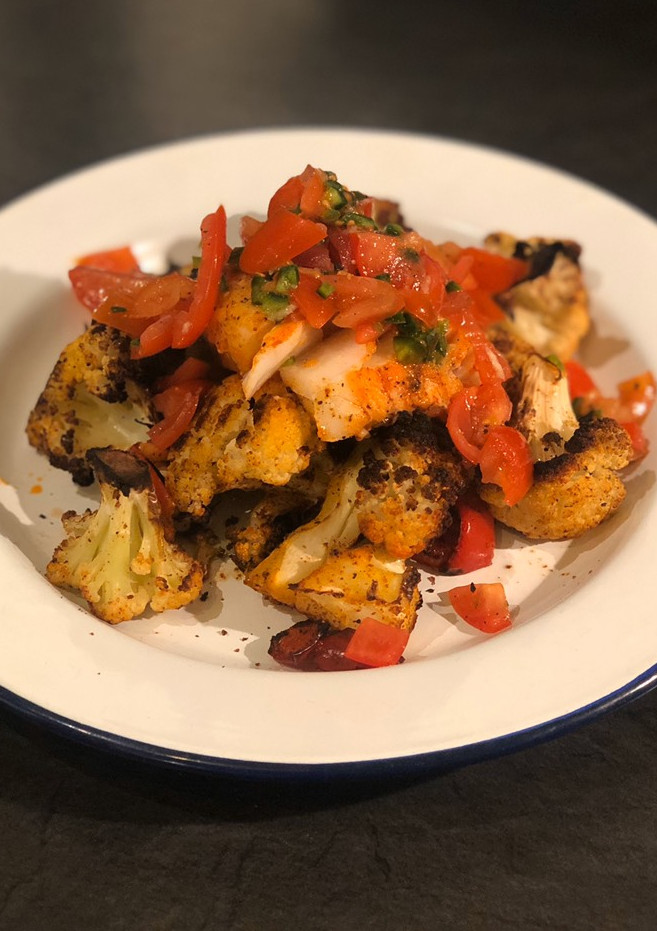 A picture of Harissa cod with spiced cauliflower and salsa.