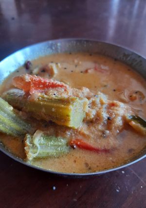A picture of Kerala style tomato drumstick gravy.