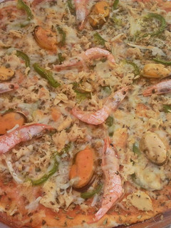 Una foto de Pizza de marisco