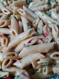 Penne creamy sauce with chopped cilantro